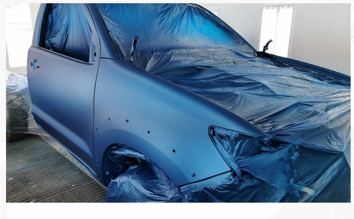 Car body panel being resprayed at Mecca Auto & General